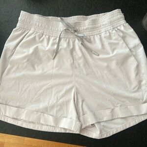 Lululemon khaki drawstring shorts with pockets - minor small stain on front